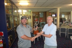 Andrew-Dukes-receiving-the-AAA-Cup-from-Captain-Steve-Grallelis